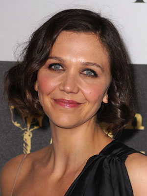 Maggie Gyllenhaal must be holding a lot of happiness because she's 