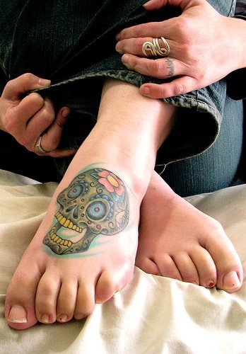 girl tattoos for foot. butterfly foot tattoos for