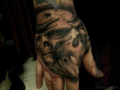 Hand Tattoo Ideas on Hand Free Tattoo Design  Skull Tattoo Designs