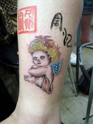 This tattoo angel is cute too except the eyes are kind of evil.