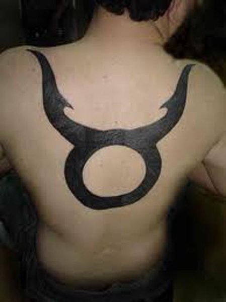 A red eyes Taurus tattoo on