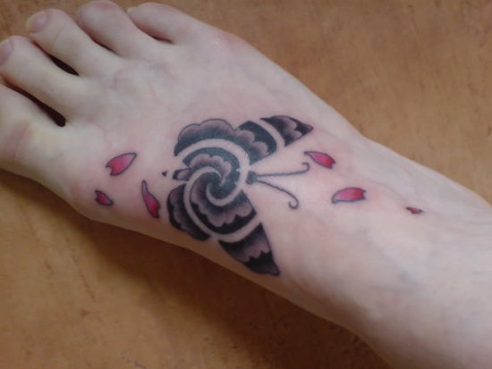 Buterfly tattoos in foot - tribal buterfly tattoos