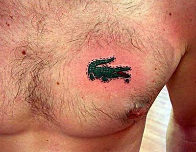 Small Alligator tattoo on chest.