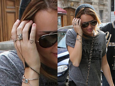 miley cyrus tattoo finger. hair miley cyrus tattoo 2011.