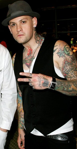 Benji Madden has "Made Man" tattooed on his knuckles.