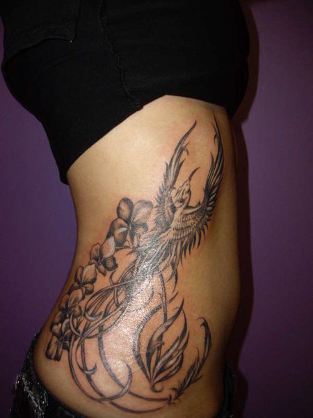 Phoenix Bird With Orchid Flower Tattoo. The meanings of orchids are very 