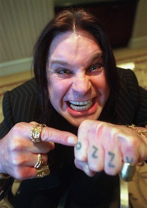 Ozzy Osbourne "Ozzy" knuckle tattoo.