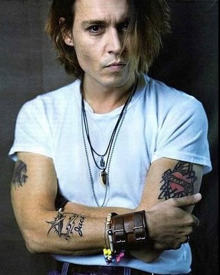 Checkout these pictures of Johnny Depp and his tattoo designs.