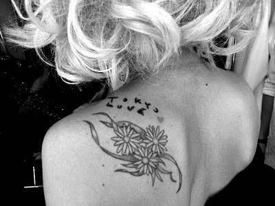 Lady Gaga has three lily flowers, along with some mysterious scribblings 