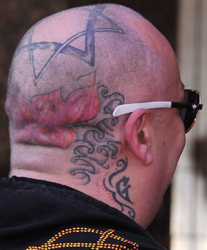 Boy George head tattoo.