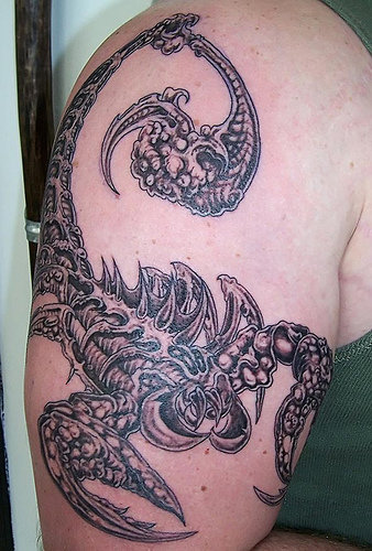 tribal tattoo arm chest. scorpio symbol tribal tattoo