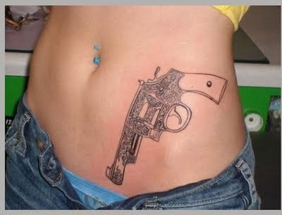 Rihanna Covers Up Gun Tattoos