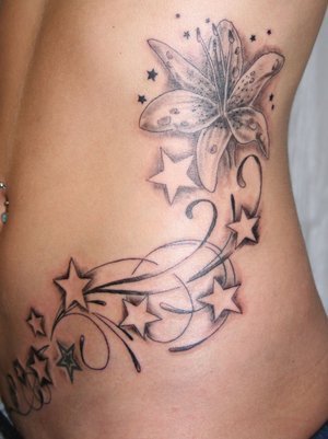 flower back tattoos. lower ack tattoo as your