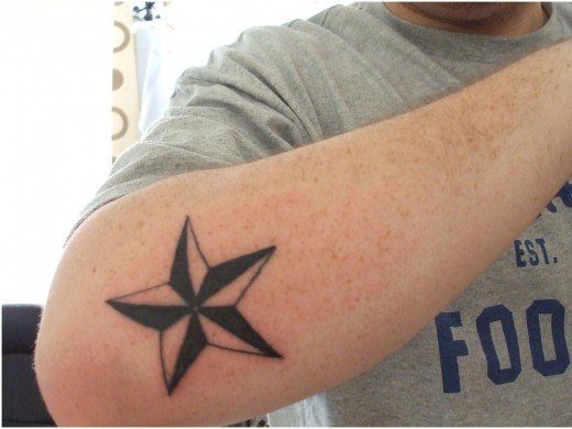 Star Tattoo Around Elbow. Star Tattoos On Elbow.