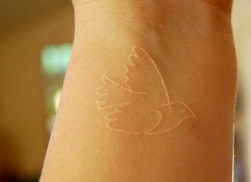 tattoos of doves. white dove tattoos. tattoos of doves.