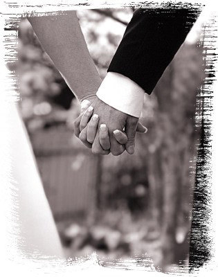 emo lovers holding hands. lovers holding hands on beach.