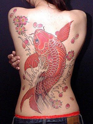 kissing fish tattoo. You can showcase a red koi fish blowing multicolored bubbles to represent the different colors of life. Another way of depicting it is to have it fighting
