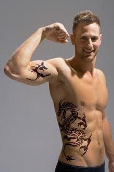 tattoos on mens ribs. The Best Tribal Dragon Tattoos