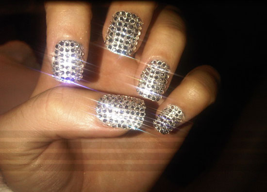 Can you can guess who belongs to these silver diamante nails?