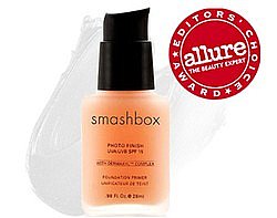 picture of smashbox photo finish foundation primer in a clear glass bottle with apricot colored cream, with an alure beauty editor award