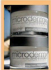 picture of two jars of Microdermx on top of each other, with clear jars containing a white cream, plus a silver top
