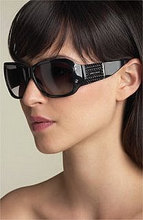 picture of a profile of a woman wearing Jimmy Choo oversized sunglasses