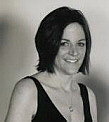black and white picture of a woman named Amanda in a black v-necked, sleeveless dress