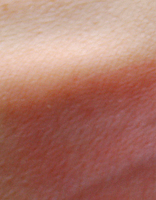 picture of swatch of Stila cherry crush lip and cheek stain on pale arm skin