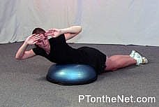 girl doing a prone spinal rotation exercise
