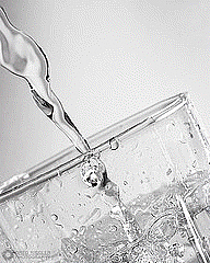 picture of a crystal clear glass of water with water pouring into the glass