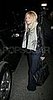 Heading to her car in wide-leg jeans in October