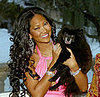 Model Kimora Lee Simmons poses for a portrait with her dog at home February 24, 2005 in Saddle River, New Jersey.