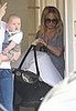 Nicole and baby Harlow leaving a party. 
