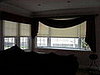 Living room After window treatments:  Swag mounted on pole, translucent roller shades --
Bay Ridge, Brooklyn, NY