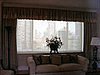 Solar shade (after) behind shirred valance with contrast banding valance and stationary drapery panels - Upper East Side, NYC