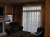 Den (After):  Roman shades and draperies in cotton jacquard with embroidered sheers, Mill Basin, Brooklyn, NY