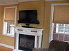 Den (After):  Roman shades and draperies in cotton jacquard with embroidered sheers, Mill Basin, Brooklyn, NY