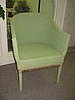 This wicker chair will come back with  a green cushion with colorful parrots.