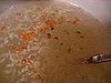 Mix sugar, vinegar, garlic and peppers together.