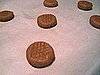 Set the rounded ball of dough on the cookie sheet and use a flat-bottomed glass to smoosh it out a bit. 