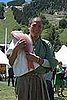 Morimoto holding a whole salmon. 