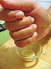 Squeezing the grated ginger