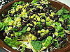 Covering with black bean and corn salad.