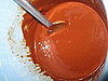 The melted butter mixed with the melted chocolate.
