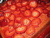 Evenly spread the strawberries over the cake. 