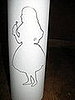 The Alice in Wonderland logo was printed on thin paper. We covered Mexican saint candles with these. 