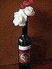 The wine bottle vases kept up with the Drink Me theme.