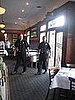 The firefighters deliver their pot of chili. 