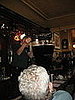 The bartender's hands shook as he poured the heavy cream over a spoon. 