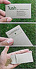 Business card from "Lush Lawn and Property Enhancement," stuffed with grass seed.